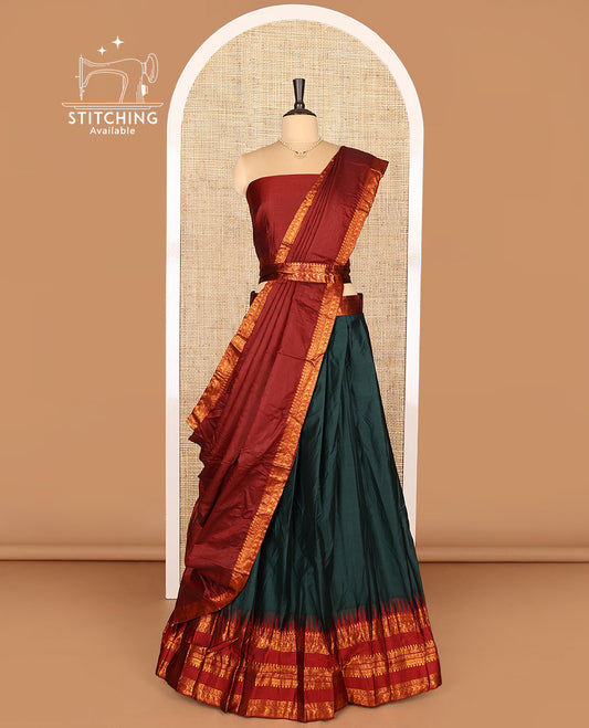 Dark Green Art Silk Half-Saree Featuring Plain Skirt, Complemented by Contrast Temple Traditional Zari Design Varisai Pettu Border, Paired with a Contrast Blouse, Contrast Zari-Bordered Dhavani, and Brocade Belt