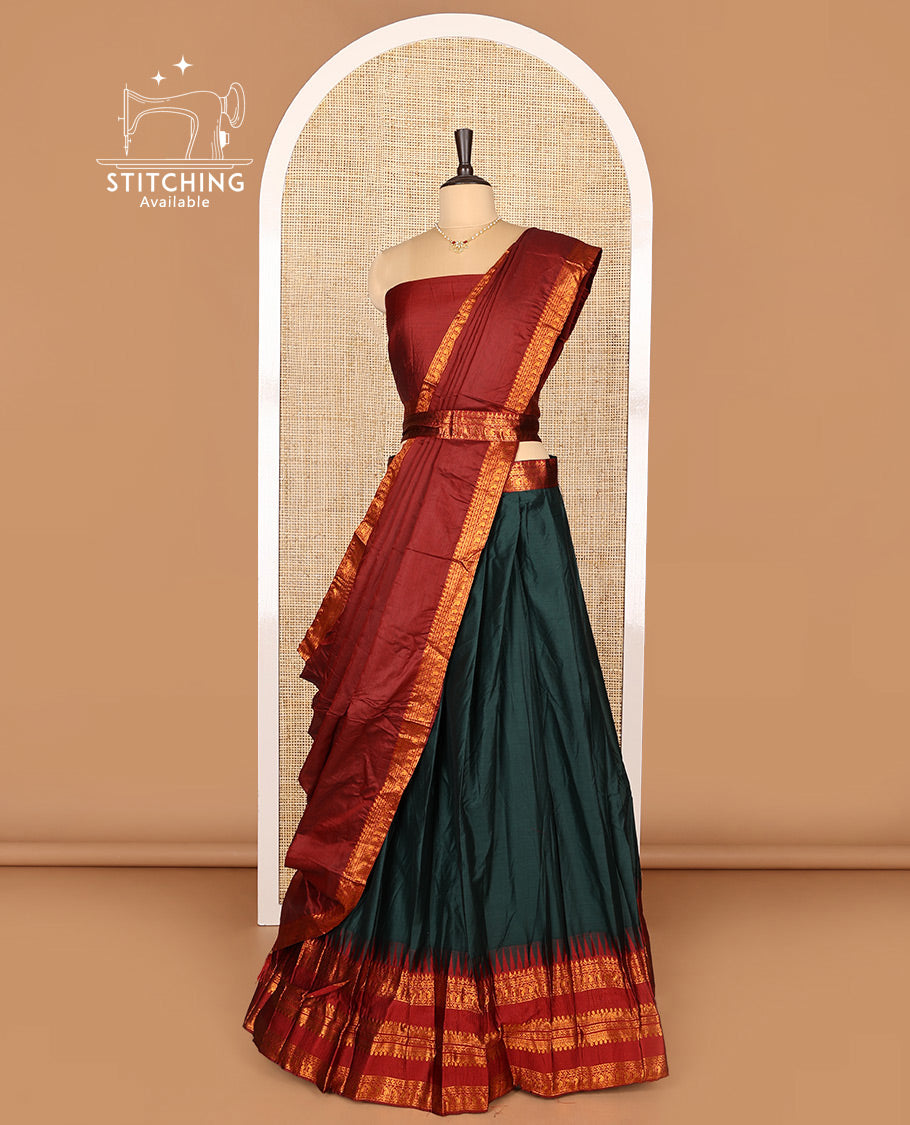 Dark Green Art Silk Half-Saree Featuring Plain Skirt, Complemented by Contrast Temple Traditional Zari Design Varisai Pettu Border, Paired with a Contrast Blouse, Contrast Zari-Bordered Dhavani, and Brocade Belt