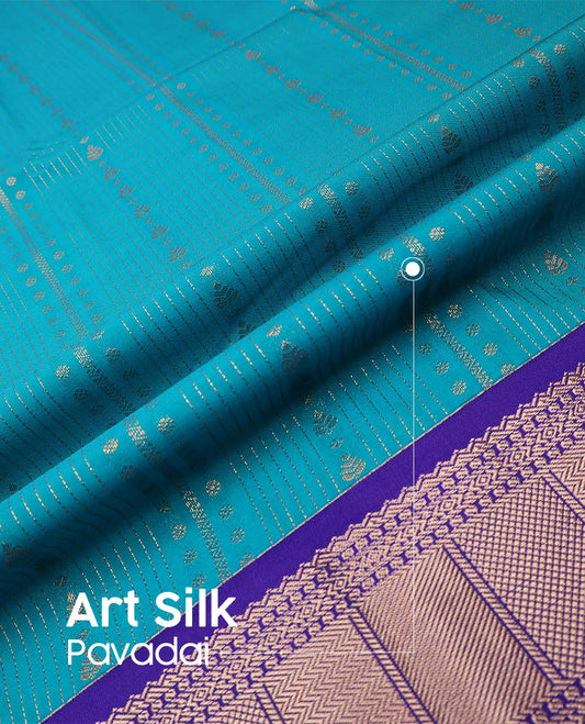 Blue art silk pavadai material, zari design with contrast traditional zari border skirt, a contrast bordered blouse
