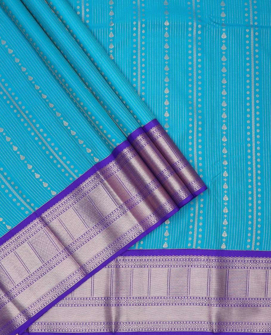 Blue art silk pavadai material, zari design with contrast traditional zari border skirt, a contrast bordered blouse
