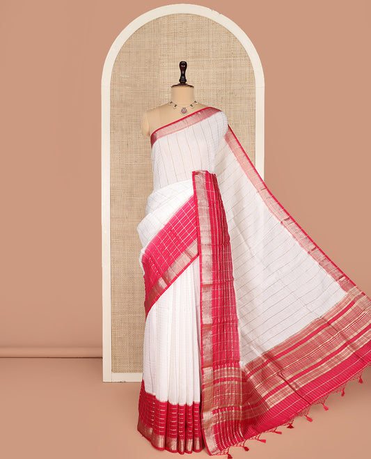 White Assam Silk Saree Richly Detailed with Zari Checks on Its Body, Complemented by a Contrast Border of Traditional Zari Designs, a Gleaming Pallu of Zari Stripes, and Paired with a Contrast Blouse