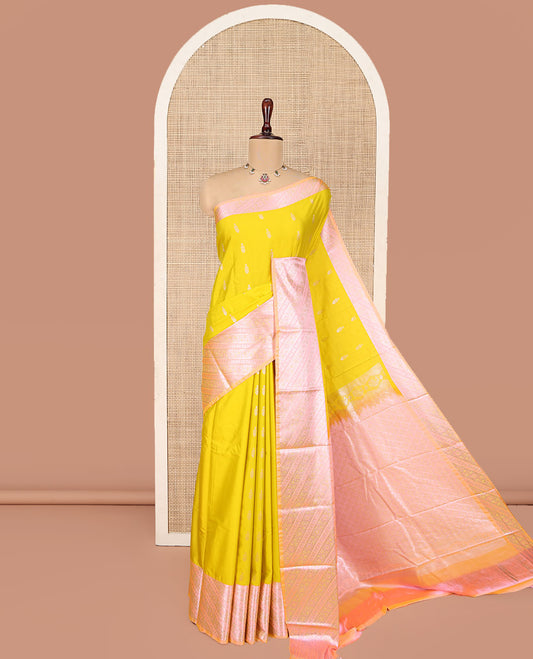 Yellow Budget Silk Saree, Sparsely Woven with Zari Buttas All Over Its Body, Complemented by Contrast Border of Floral-Paisley Designs, Beautifully Bedecked Pallu of Jaal Designs, and Paired with a Contrast Blouse