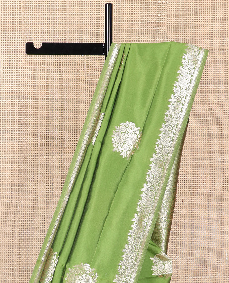 Green floral motifs design butter silk saree with self intricate zari design border & floral design pallu