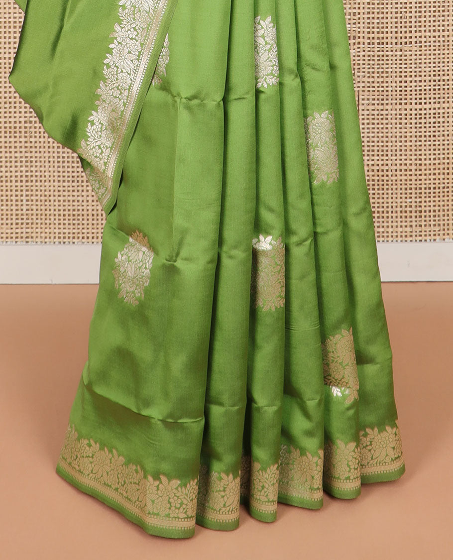 Green floral motifs design butter silk saree with self intricate zari design border & floral design pallu
