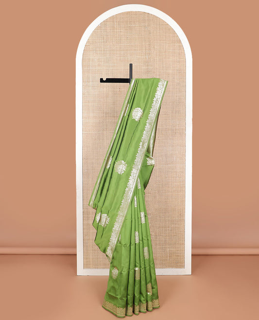 Green floral motifs design butter silk saree with self intricate zari design border & floral design pallu