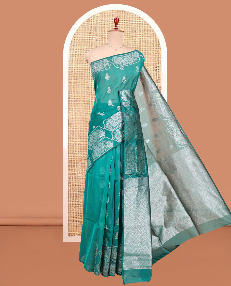 Green Semi-Silk Cotton Saree, Elevated with Zari Buttas All Over Its Body, a Subtle Border of Floral Designs, Grand Jaal Pallu, and Paired with a Matching Blouse