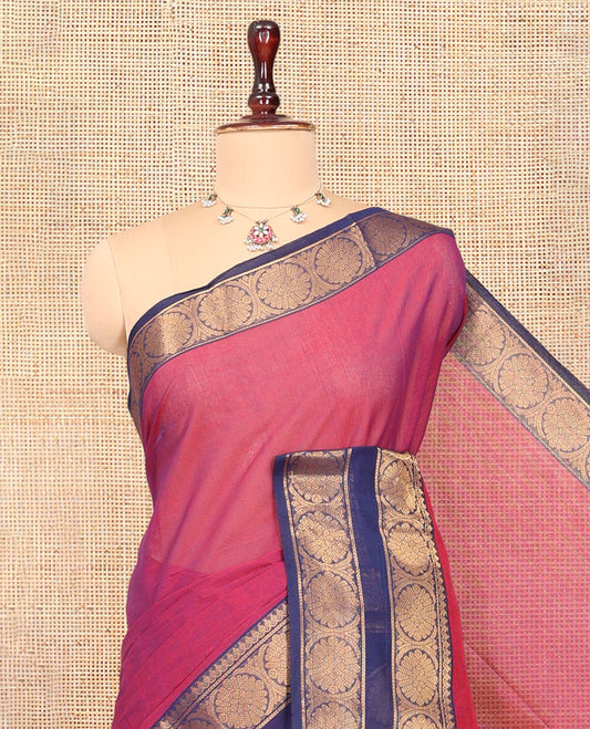 Pink Plain Chettinad Cotton Saree Highlighted by a Contrast Temple Chakra Border, a Striped Pallu and a Matching Blouse