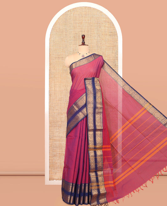Pink Plain Chettinad Cotton Saree Highlighted by a Contrast Temple Chakra Border, a Striped Pallu and a Matching Blouse