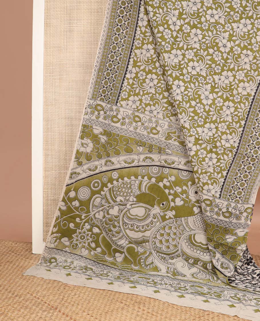 Green floral machine printed kalamkari cotton saree, geometric printed border, and pallu of peacock print