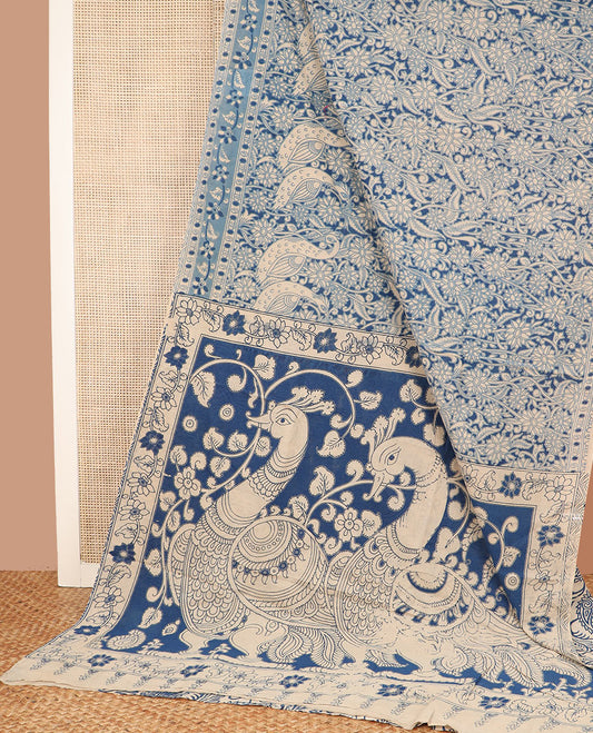 Blue floral-bird machine-printed kalamkari cotton saree, printed border, and pallu of kalamkari peacock motifs