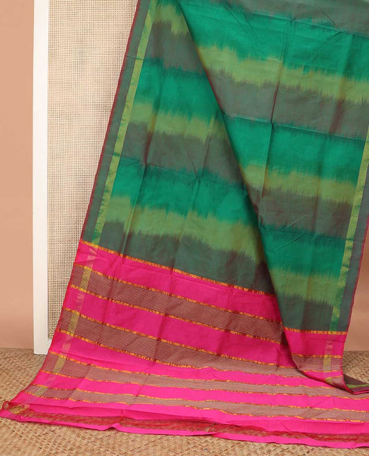 Green ikkat poly cotton saree, self-border, and contrast striped pallu