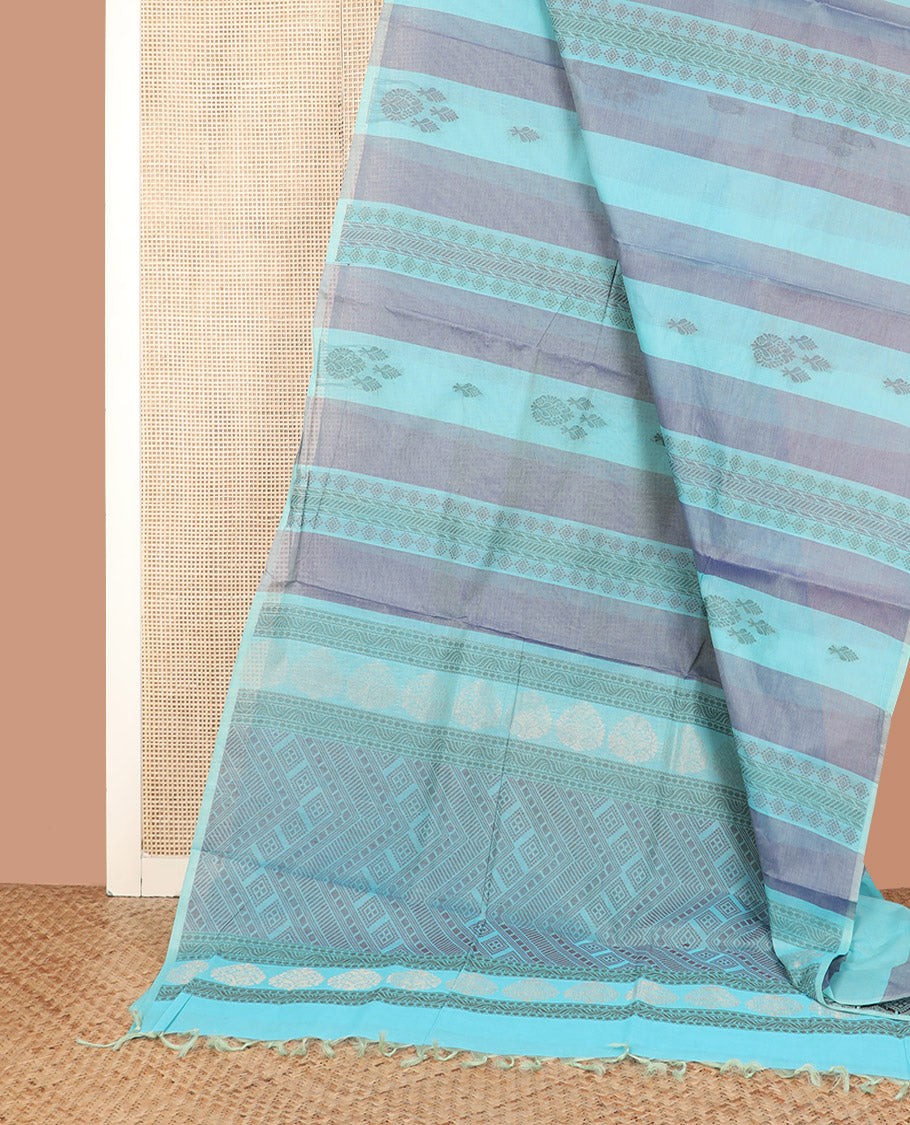 Borderless Blue Coimbatore Cotton Saree Prettified with Intricate Buttas All Over Its Body, Pallu Pictures Intricate Patterns, and Paired with a Plain Matching Blouse
