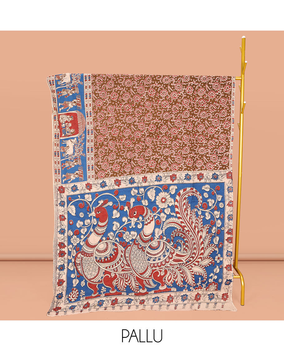 Brown Machine-Printed Kalamkari Cotton Saree, Decked Up with Floral Motifs on Its Body, Complemented by a Contrast Village-Theme Printed Border, Pallu of Peacock Motifs Print, and Paired with a Printed Blouse