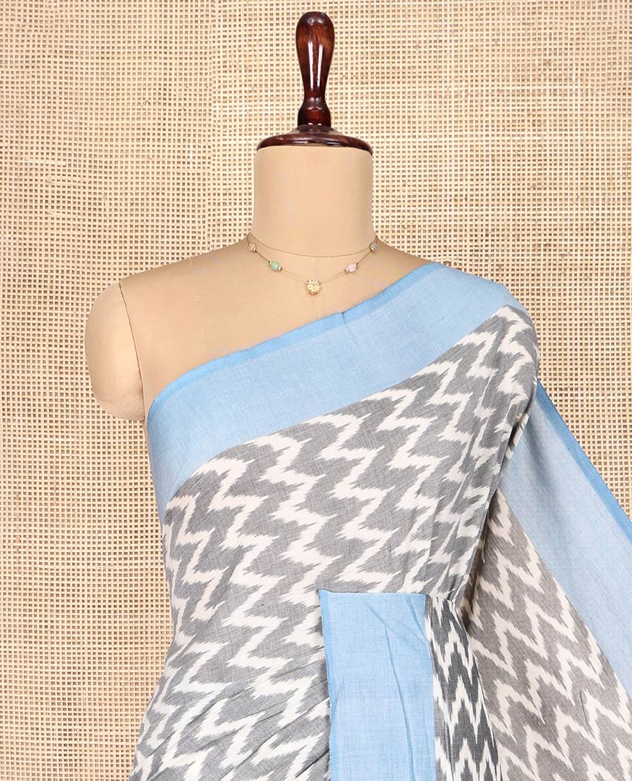 Grey Ikkat Cotton Saree, Bedecked with Ikkat-Style Chevron Stripes on Its Body, Complemented by Contrast Border, Pallu of Ikkat Ogee Patterns, and Has No Blouse