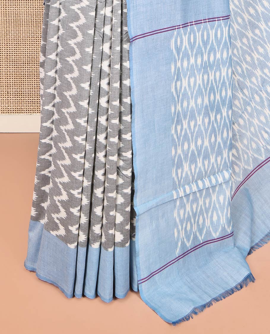 Grey Ikkat Cotton Saree, Bedecked with Ikkat-Style Chevron Stripes on Its Body, Complemented by Contrast Border, Pallu of Ikkat Ogee Patterns, and Has No Blouse
