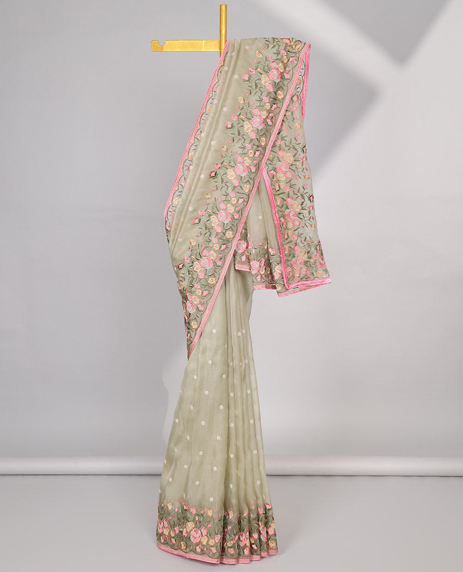 Light green motifs embroidery net designer saree with self floral border & floral embroidery pallu 