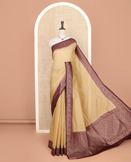 Sandal Fancy Georgette Saree Detailed with Zari Buttas, Complemented by a Contrast Border of Floral Creeper Designs, Grandly Woven Pallu Featuring Floral Jaal Designs in Zari, and Paired with a Contrast Blouse
