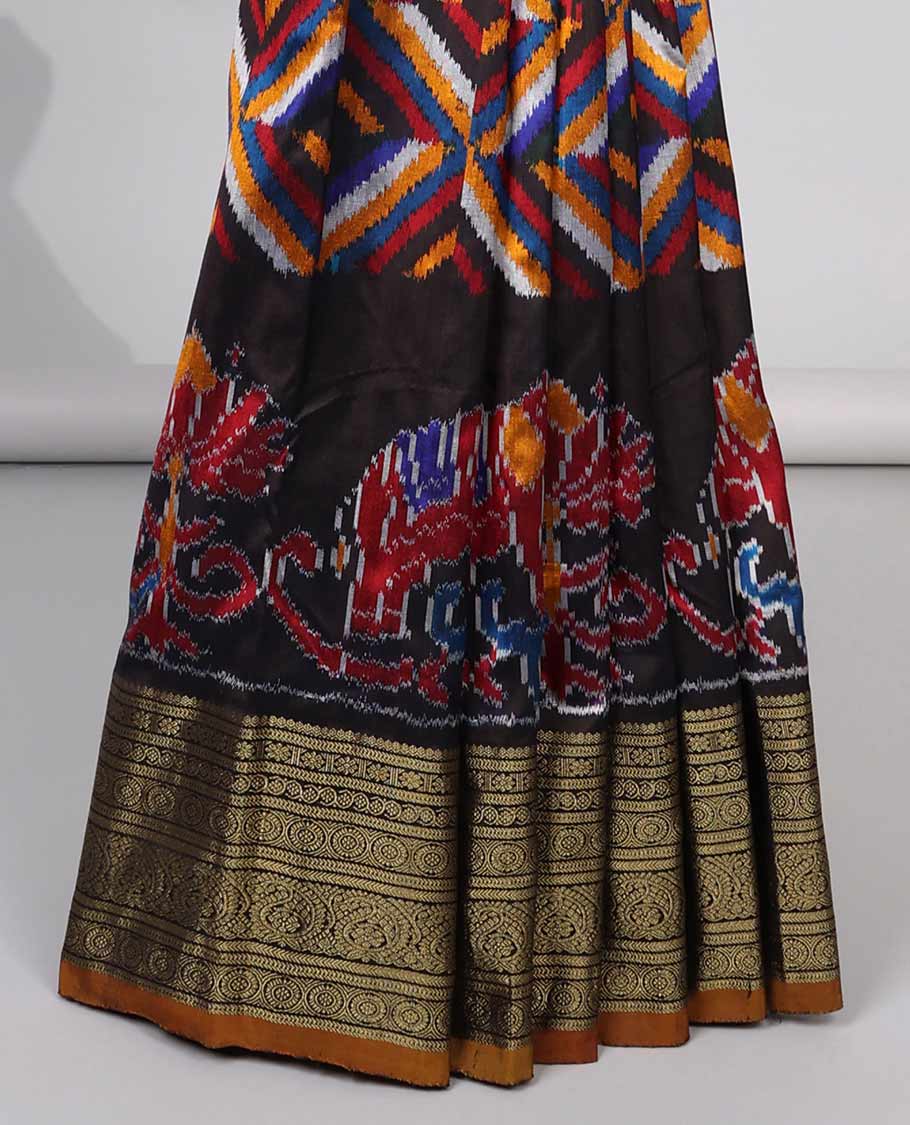 Black geometric, floral & animal design ikkat saree with contrast zari design border & traditional zari design pallu