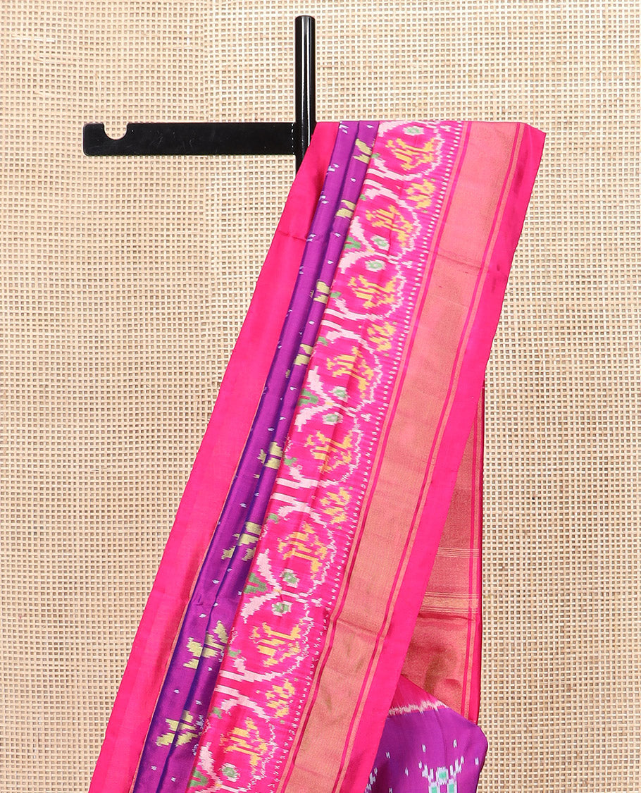 Rani Pink Ikkat Silk Saree Adorned with Colourful Buttas, Complemented by an Ikkat Woven Border, a Colourfully Woven Ikkat Pallu, and a Contrast Blouse