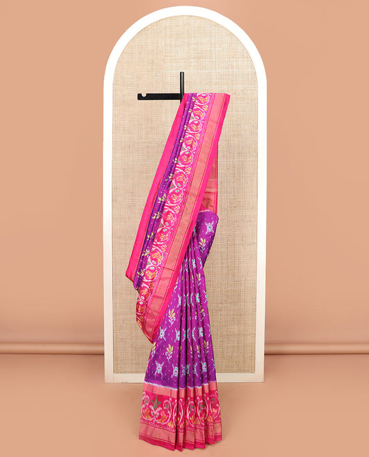 Rani Pink Ikkat Silk Saree Adorned with Colourful Buttas, Complemented by an Ikkat Woven Border, a Colourfully Woven Ikkat Pallu, and a Contrast Blouse