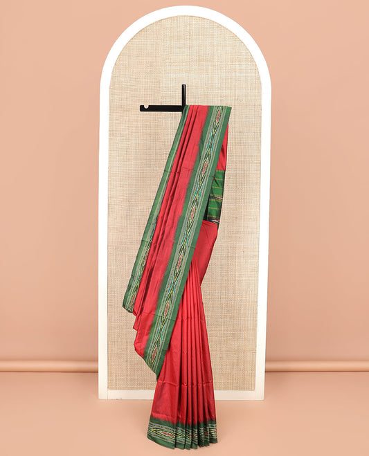Persian Red Plain Ikkat Silk Saree with a Contrast Green Border Beautified by a Hazy Ikkat Weave, and a Pallu Depicting Stripes and Ikkat Texture