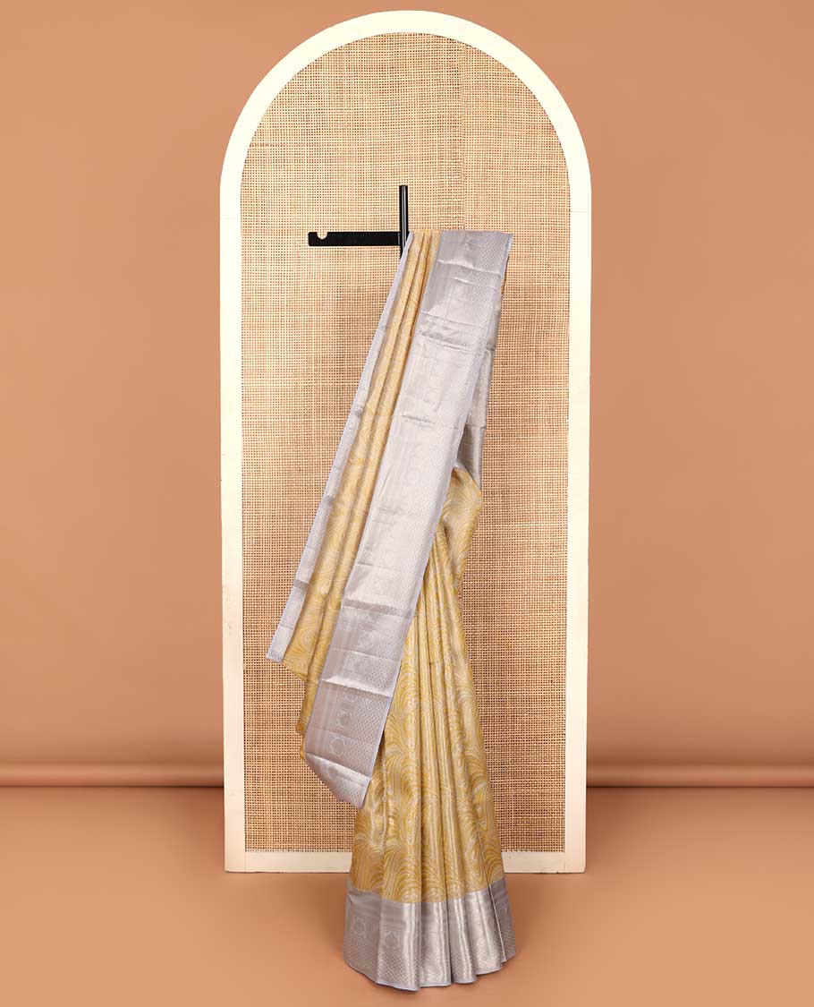 Yellow jacquard Kanchipuram tissue silk saree, contrast border of thilakam mokku, muthu, kathir, puli nagam, and jaal designs, and butta enclosed checks