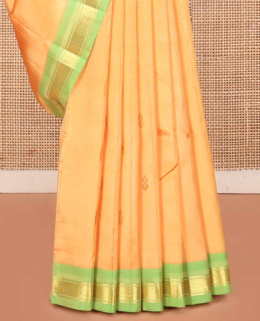 Orange Kanchipuram Silk Saree, Sparsely Woven with Zari Buttas, a Contrast One-Sided Border of Mayil Kann Designs, a Zari-Design Pallu, and No Blouse