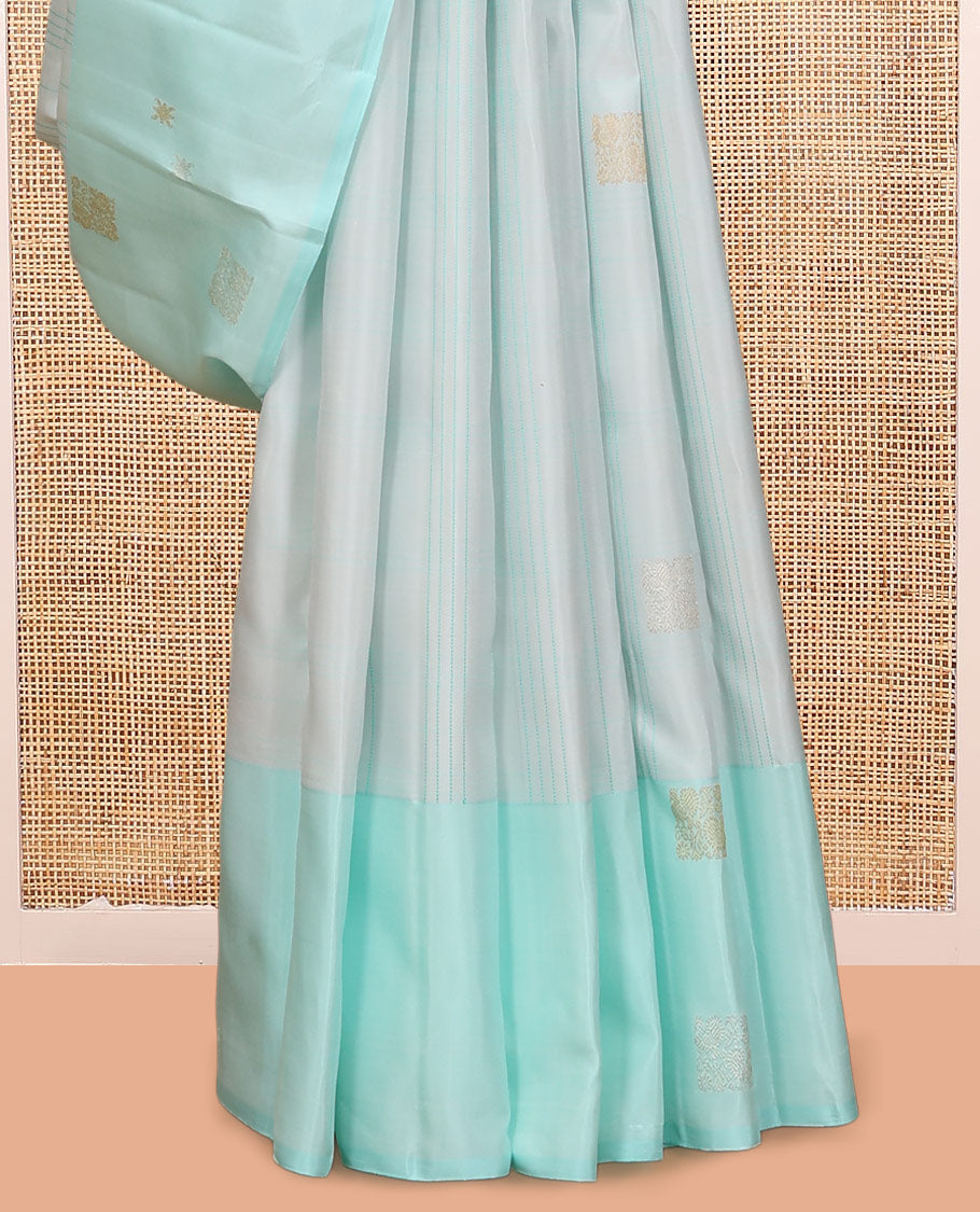 Pale Blue Kanchipuram Silk Saree, Subtly Sparkled with Buttas, and Stripes, a Contrast Border, Zari Design Pallu, and a Matching Blouse