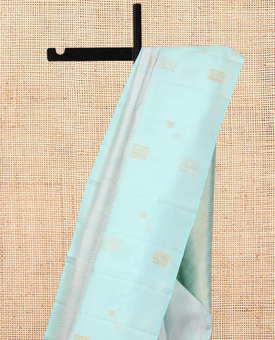 Pale Blue Kanchipuram Silk Saree, Subtly Sparkled with Buttas, and Stripes, a Contrast Border, Zari Design Pallu, and a Matching Blouse