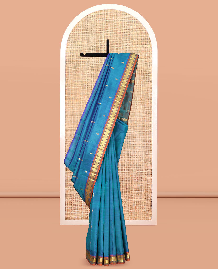 Blue Kanchipuram Silk Saree, Elevated with Zari Buttas, Complemented by a Contrast One-Sided Border of Banaras, and Mayil Kann Designs, Zari Woven Pallu, and a No Blouse