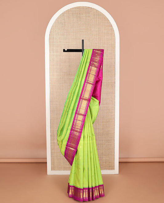 Green buttas kanceepuram silk saree with contrast korvai border of thilakam mokku, banaras design & zari design pallu