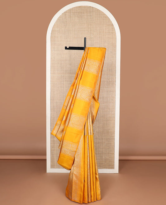 Borderless orange floral design kancheepuram silk saree with argyle design pallu