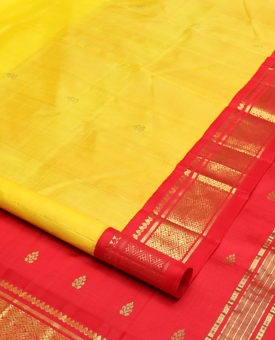 Yellow zari buttas Kanchipuram silk saree, contrast one-sided korvai border of salangai, banaras, and jaal design, and zari design pallu