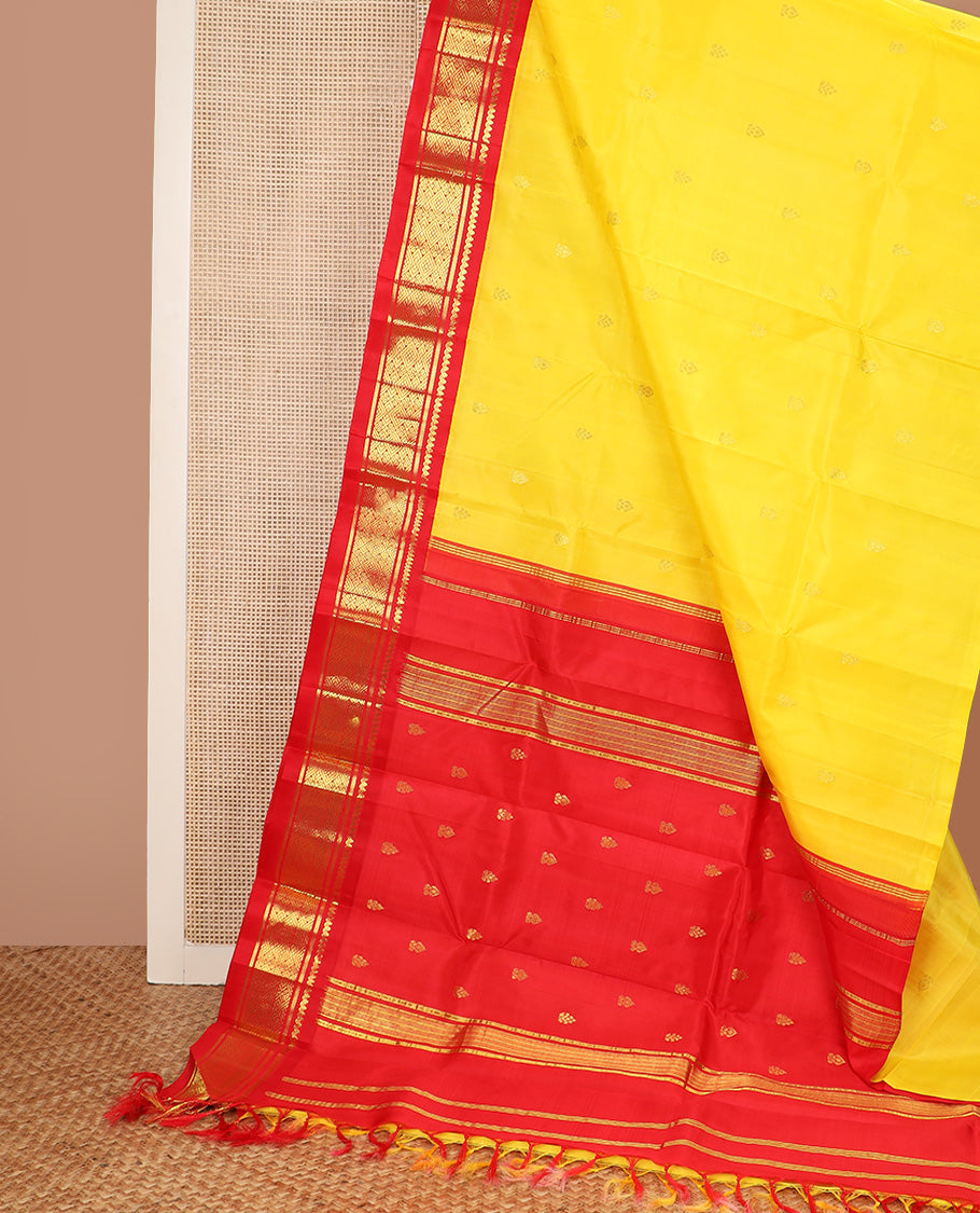 Yellow zari buttas Kanchipuram silk saree, contrast one-sided korvai border of salangai, banaras, and jaal design, and zari design pallu