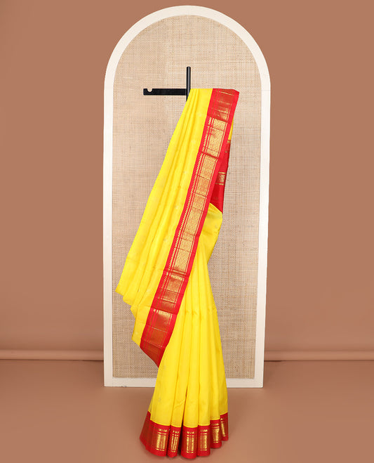 Yellow zari buttas Kanchipuram silk saree, contrast one-sided korvai border of salangai, banaras, and jaal design, and zari design pallu