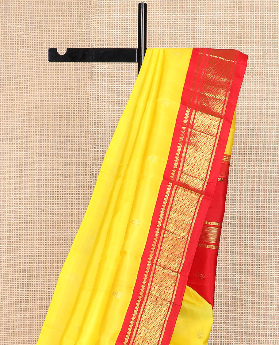 Yellow zari buttas Kanchipuram silk saree, contrast one-sided korvai border of salangai, banaras, and jaal design, and zari design pallu
