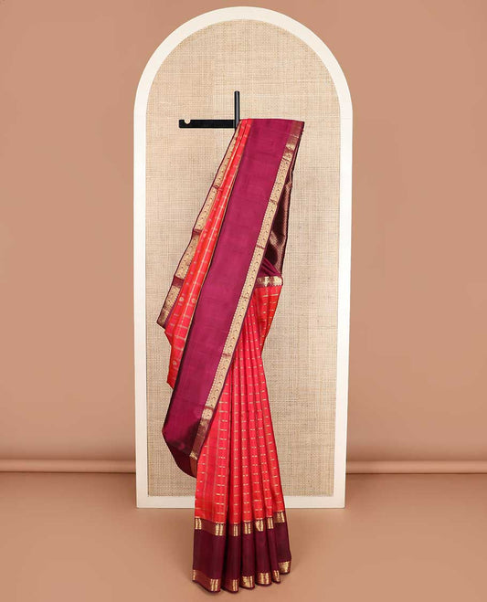 Red checked with zari buttas Kanchipuram silk saree, contrast rettai pettu border of thilakam, muthu, annam chakram designs, and jaal pallu