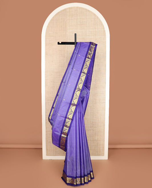 Lavender zari buttas Kanchipuram silk saree, contrast border of thilakam mokku, poun, thazampoo rekku, and neli designs, and zari design pallu