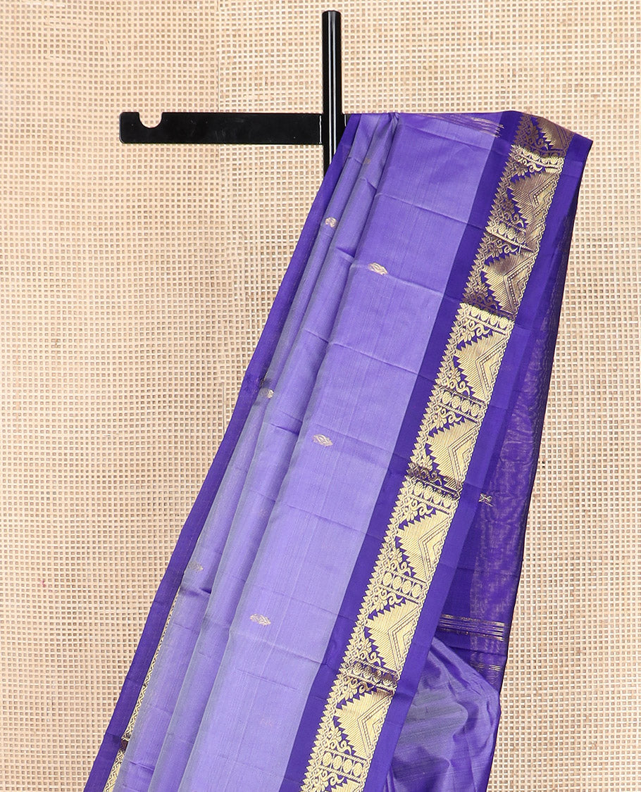 Lavender zari buttas Kanchipuram silk saree, contrast border of thilakam mokku, poun, thazampoo rekku, and neli designs, and zari design pallu