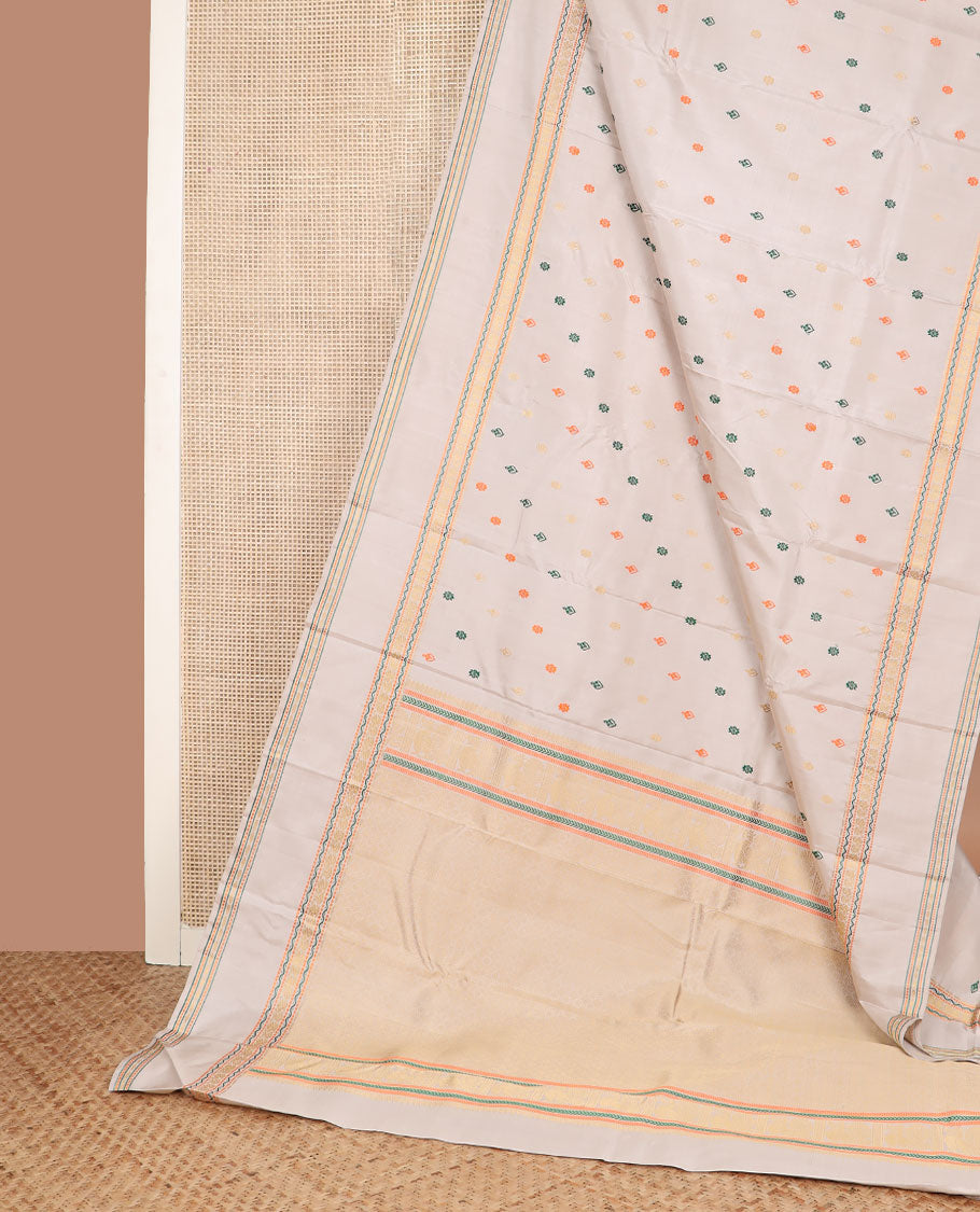 Cream thread buttas Kanchipuram silk saree, rettai pettu border of muthu, neli, and mayil designs, and jaal pallu