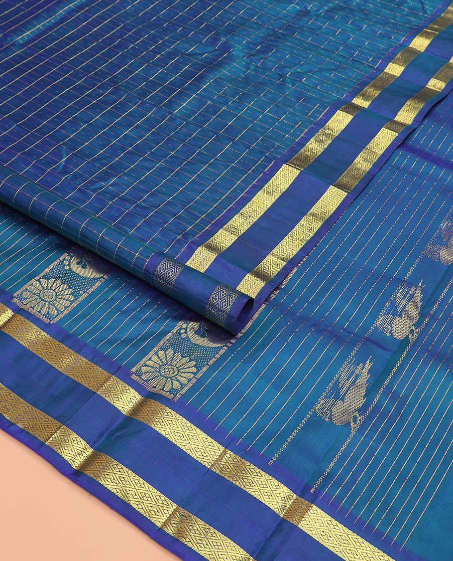 Blue zari checked Kanchipuram silk saree, rettai pettu diamond patterned border, and pallu of annam, kamalam, and manga designs
