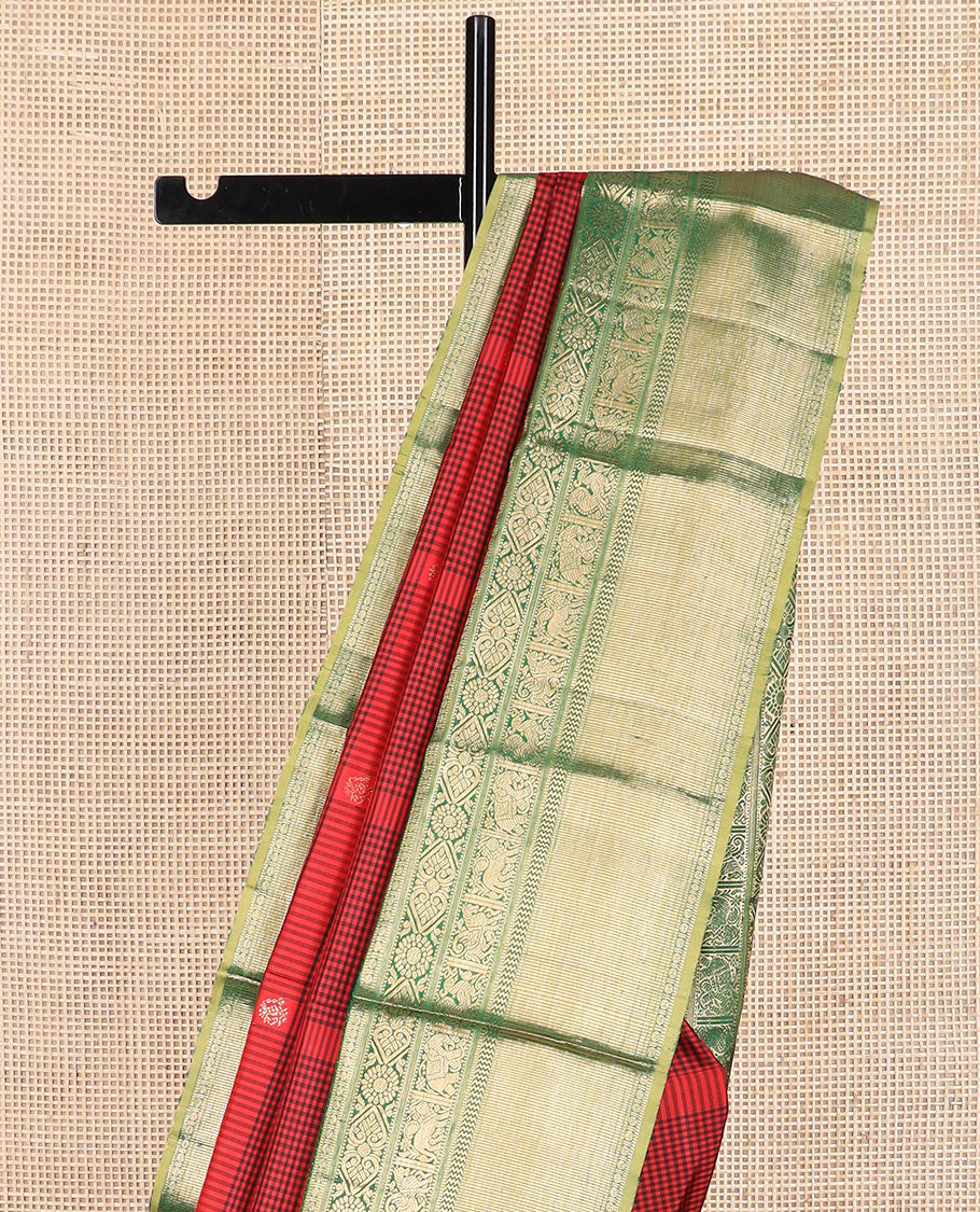 Red checked and buttas Kanchipuram silk saree, contrast border of muthu, rudraksham, chakram, jada nagam, yaanai, mayil,  and vanki designs, and intricate pallu