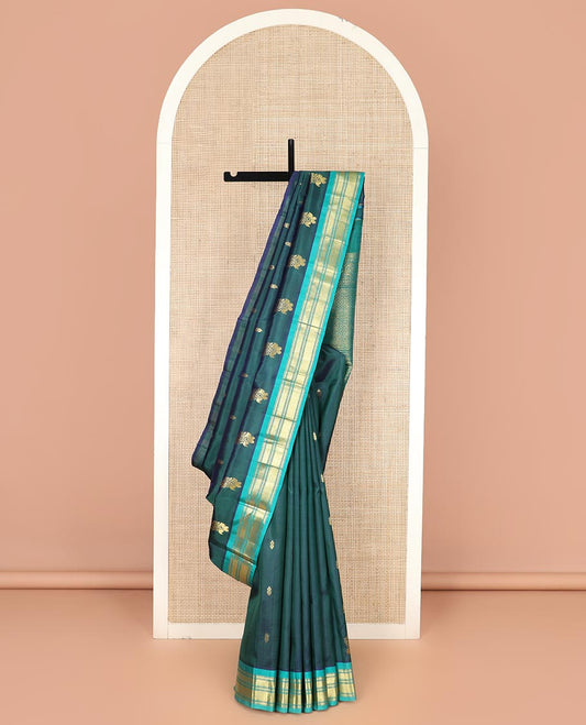 Green Kanchipuram Silk Saree, Finely Woven with Zari Buttas All Over Its Body, Complemented by Contrast One-sided Border Featuring Muthu, Kathir, and Vanki Designs, Zari Elevated Pallu of Jaal Designs, and Comes Without a Blouse