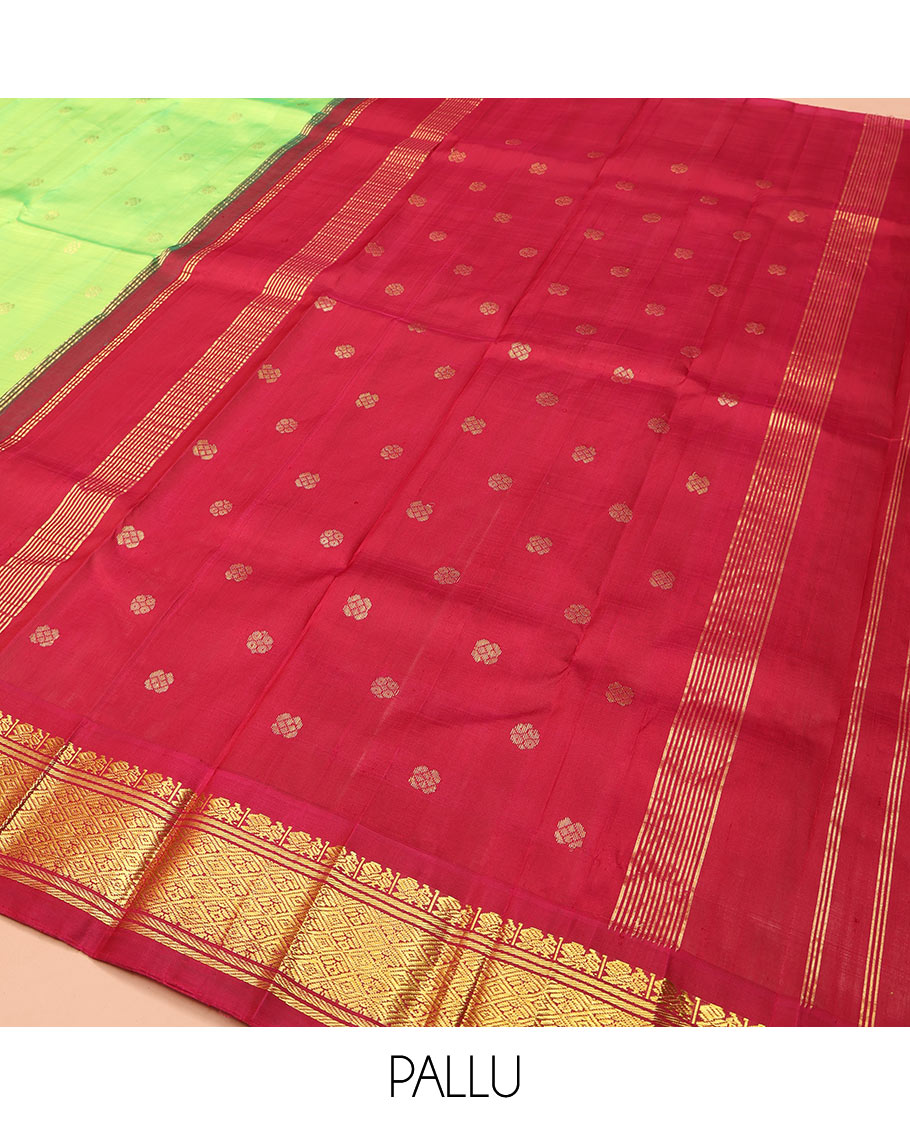 Green Kanchipuram Silk Saree, Delicately Woven with Zari Buttas on Its Body, Complemented by a Contrast One-Sided Thazampoo Rekku Border of Mayil and Jaal Designs, Pallu Depicts Zari Designs, and Comes Without a Blouse