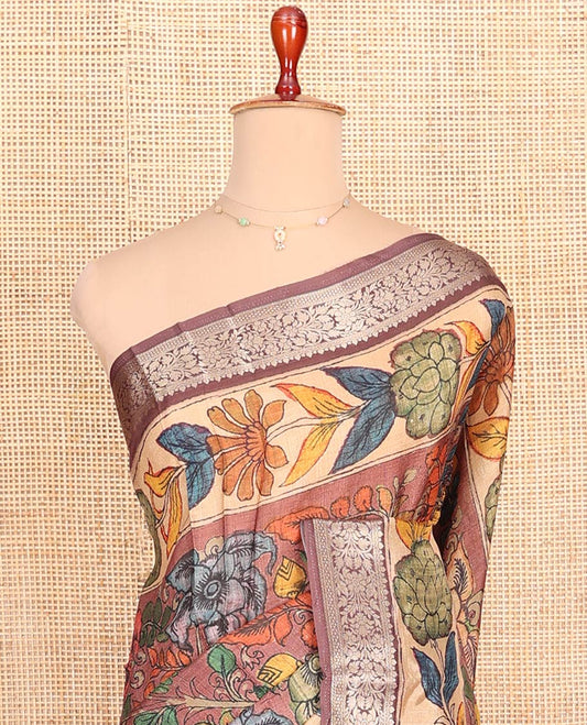 Brown Semi-Tussar Saree Accentuated with Kalamkari-Style Colorful Floral Design Print, Complemented by a Contrast Floral-Theme Zari and Print Work Border, Pallu of Ancient God and Goddess Motifs Print, and Paired with a Contrast Blouse