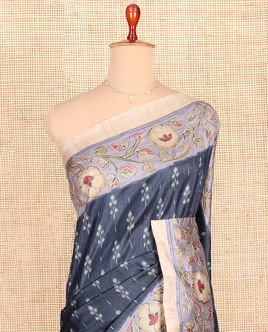 Blue Semi-Tussar Saree Adorned with Ikkat-Style Buttas, Complemented by a Contrast Floral Creeper Printed with Kantha Work Border, Pallu Featuring Floral and Peacock Print, and Paired with a Contrast Printed Blouse