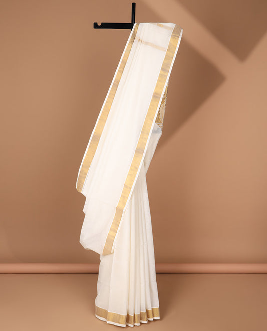Cream kerala saree with zari stripes, zari border & pallu of peacocks