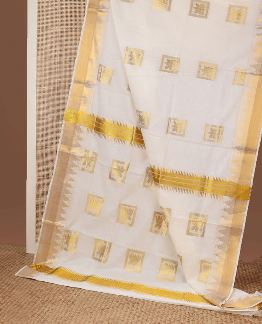 Cream zari Pichwai lotus buttas Kerala saree, zari temple border, and pallu of Pichwai lotus motifs