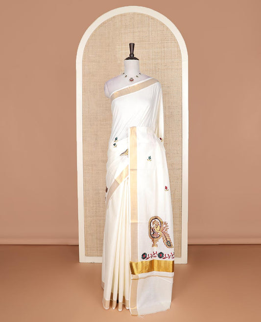 Cream floral motifs embroidered Kerala cotton saree, bavanji border, and peacock embroidered pallu