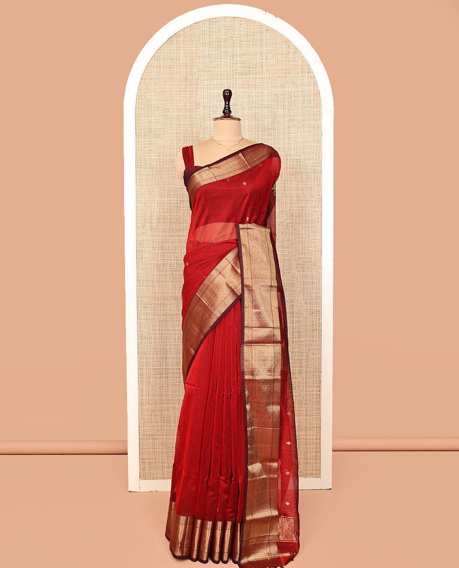 Red Maheshwari Cotton Saree, Accentuated with Buttas All Over Its Body, Complemented by a Contrast Traditional Zari Woven Border of Chevron Designs, Pallu Mirrors the Same Design, and Paired with a Matching Blouse